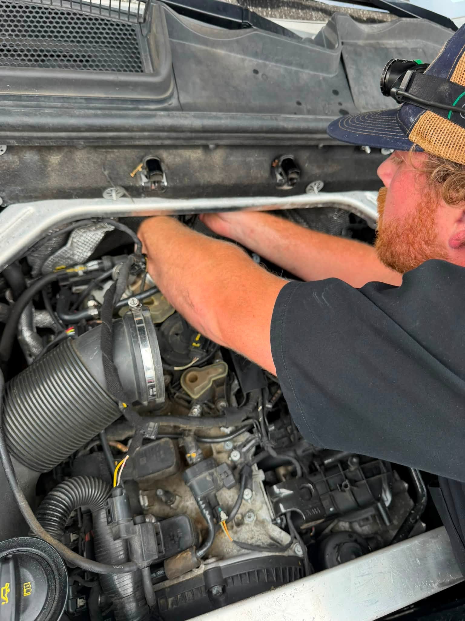 a mechanic working on a vehicle