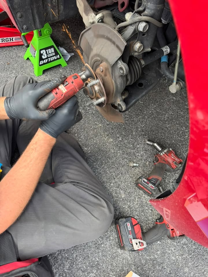 worker fixing a vehicle